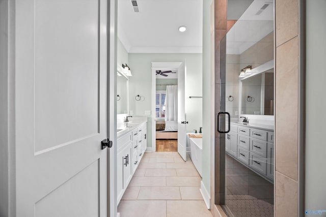 bathroom featuring tile patterned flooring, crown molding, vanity, and ceiling fan