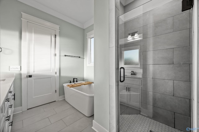 bathroom with independent shower and bath, vanity, and tile patterned floors