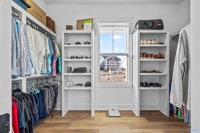 walk in closet featuring hardwood / wood-style flooring