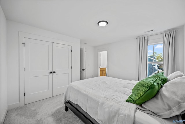 carpeted bedroom with a closet