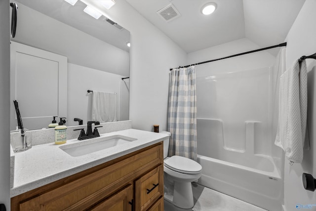 full bathroom with vanity, shower / tub combo, and toilet