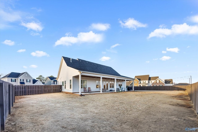 rear view of house featuring a patio