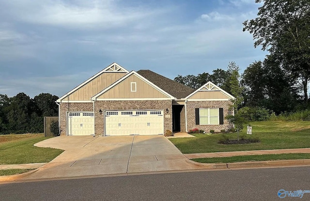 craftsman house featuring a garage and a front yard