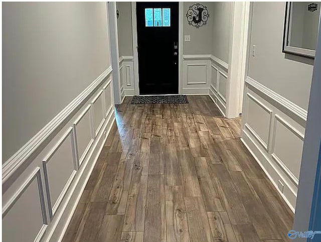 doorway to outside with dark hardwood / wood-style flooring