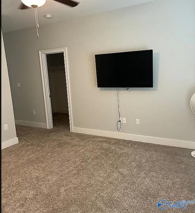 unfurnished living room with carpet flooring and ceiling fan