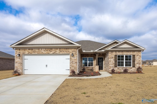 craftsman house with a garage and a front lawn