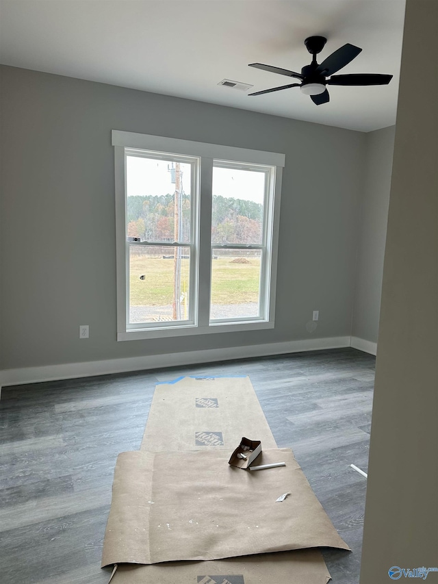 spare room with light hardwood / wood-style floors and ceiling fan