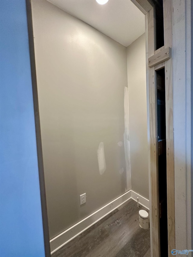 bathroom with hardwood / wood-style flooring