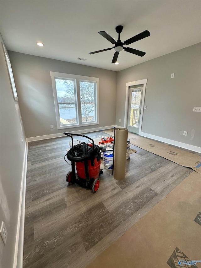 spare room with hardwood / wood-style floors and ceiling fan