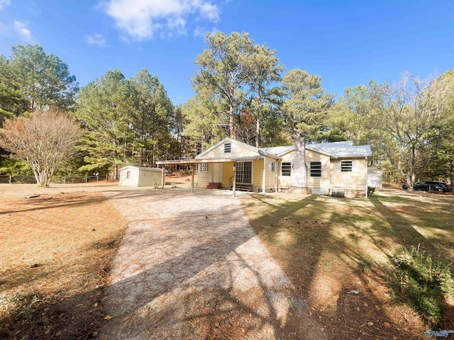 ranch-style house featuring a shed