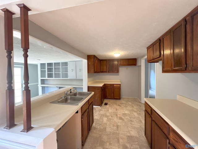 kitchen featuring sink and a textured ceiling