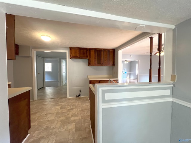 kitchen featuring kitchen peninsula and a textured ceiling