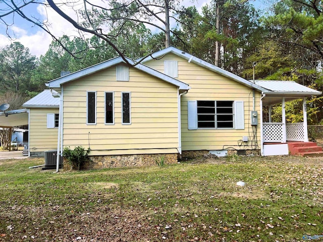 back of house with a yard