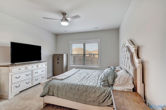 carpeted bedroom with visible vents and ceiling fan