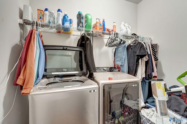 washroom with laundry area and washer and dryer