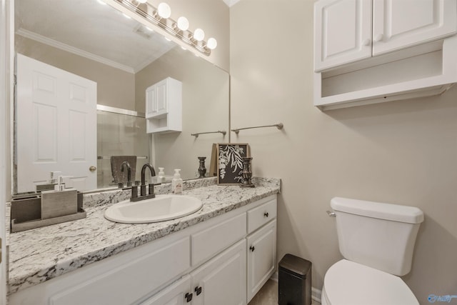 bathroom featuring crown molding, toilet, an enclosed shower, and vanity