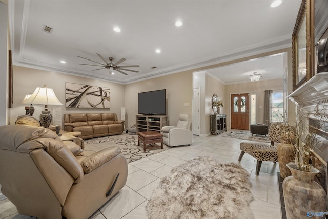 living area featuring visible vents, recessed lighting, ornamental molding, and ceiling fan