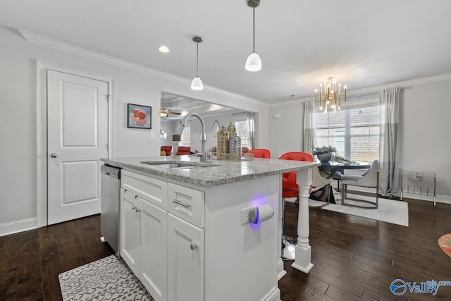 kitchen with white cabinetry, stainless steel dishwasher, sink, pendant lighting, and an island with sink