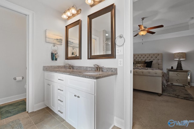 bathroom with ceiling fan, vanity, and crown molding