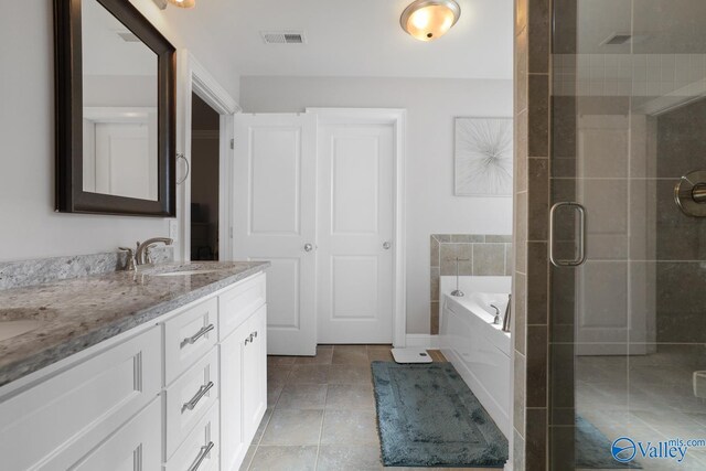 bathroom featuring vanity and plus walk in shower