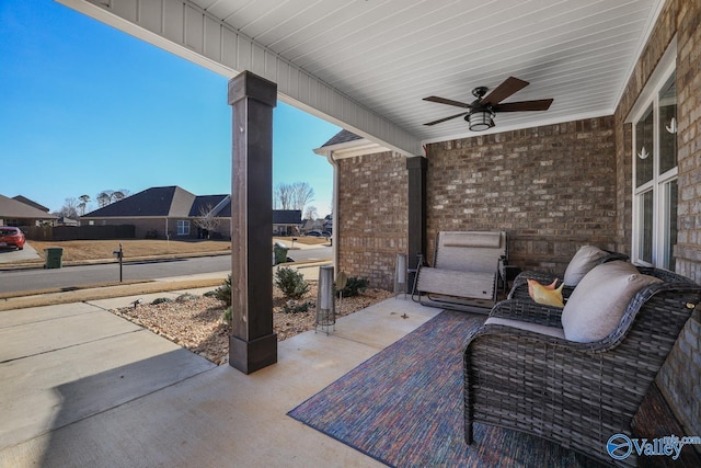 view of patio featuring ceiling fan