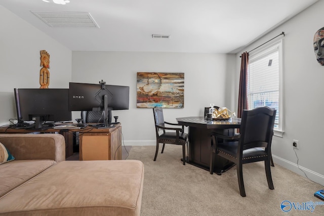 dining space with plenty of natural light and light colored carpet