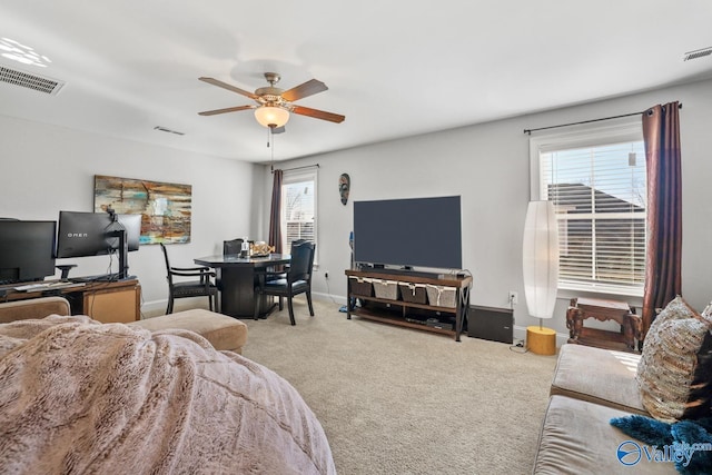 carpeted living room featuring ceiling fan