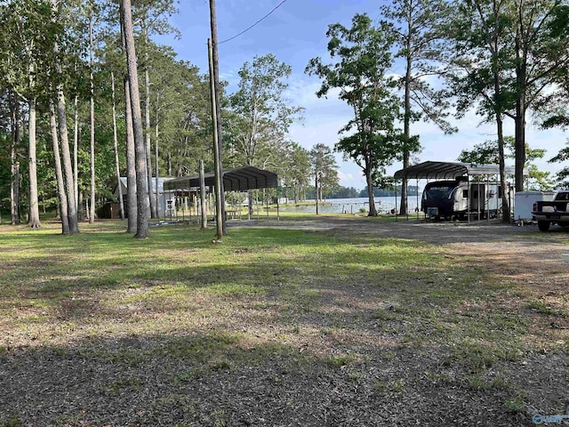 1165 Sunset Dr, Leesburg, AL 35983 - view of grassy yard with a detached carport and a water view