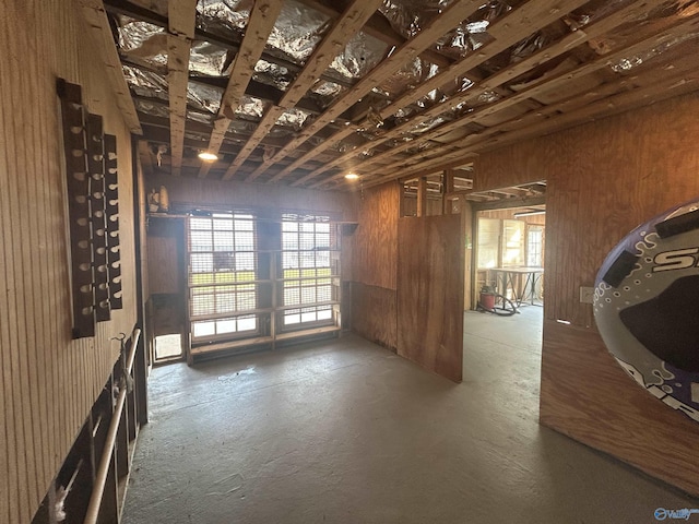 1165 Sunset Dr, Leesburg, AL 35983 - miscellaneous room featuring wood walls and concrete floors
