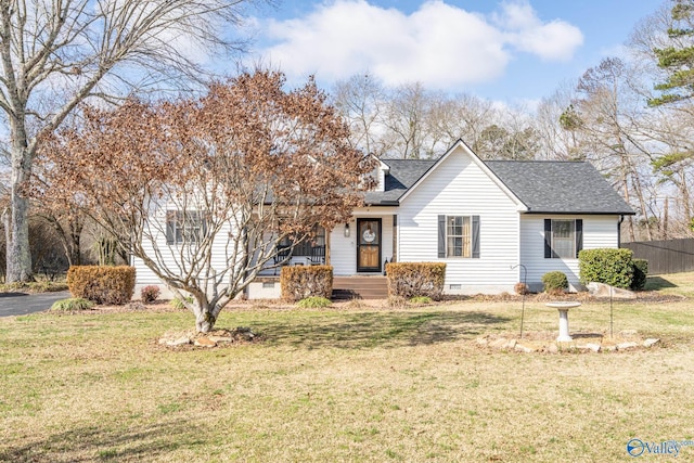 view of front of property with a front yard, crawl space, roof with shingles, and fence