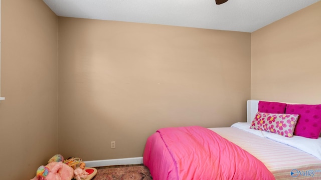 bedroom featuring carpet flooring, baseboards, and ceiling fan