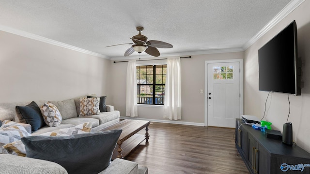 living room with a textured ceiling, ornamental molding, dark wood-style floors, and ceiling fan