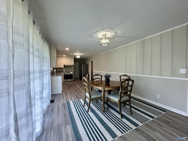 dining space with light hardwood / wood-style floors