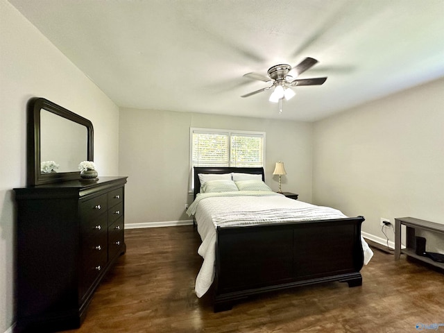 bedroom featuring dark wood-type flooring and ceiling fan