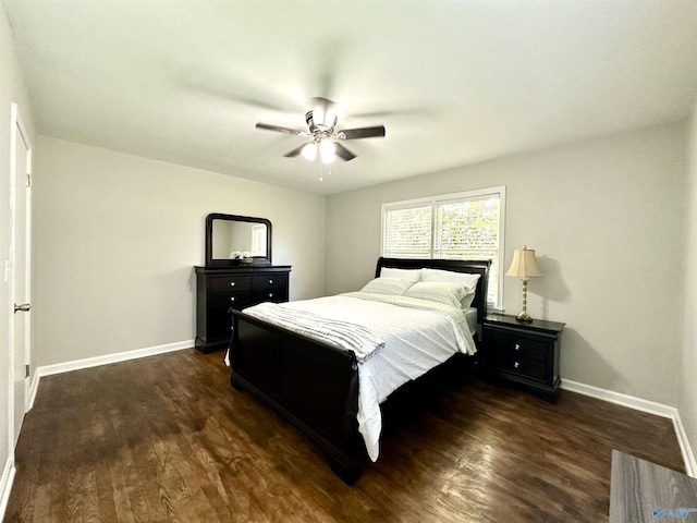 bedroom featuring dark hardwood / wood-style flooring and ceiling fan