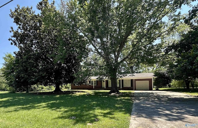 view of front of house with a garage and a front yard