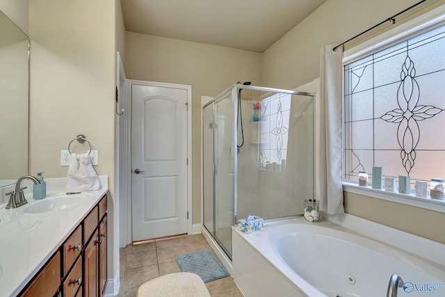 bathroom with a whirlpool tub, tile patterned flooring, a shower stall, and vanity