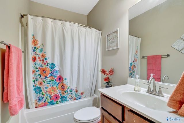 bathroom featuring shower / bath combo, vanity, and toilet