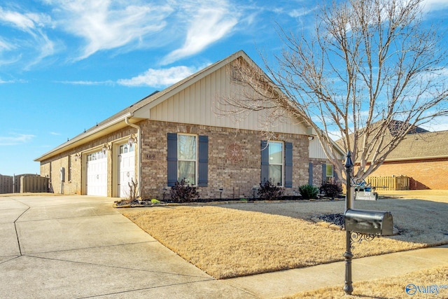 ranch-style house with brick siding, driveway, an attached garage, and fence