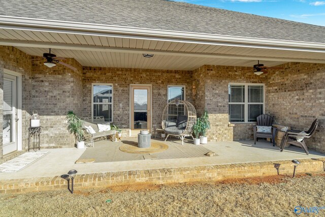 exterior space featuring a ceiling fan