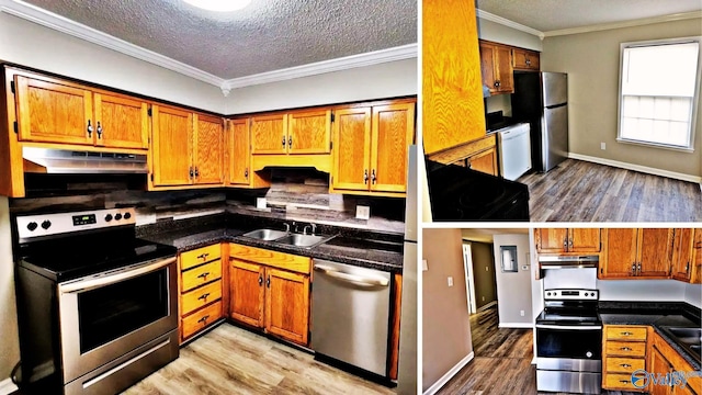 kitchen featuring sink, a textured ceiling, ornamental molding, stainless steel appliances, and light hardwood / wood-style floors