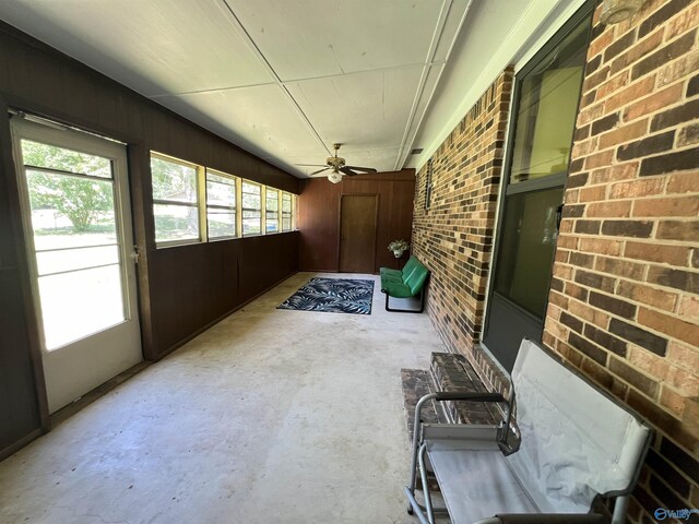 interior space with ceiling fan