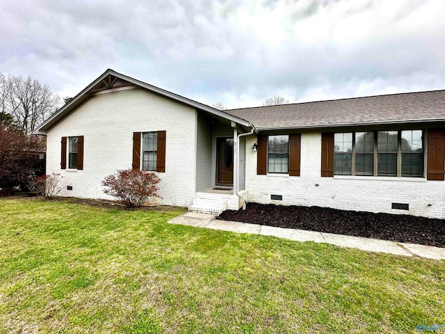 ranch-style home with a front lawn