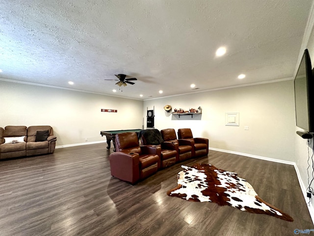 living room with dark hardwood / wood-style flooring, ceiling fan, ornamental molding, and a textured ceiling