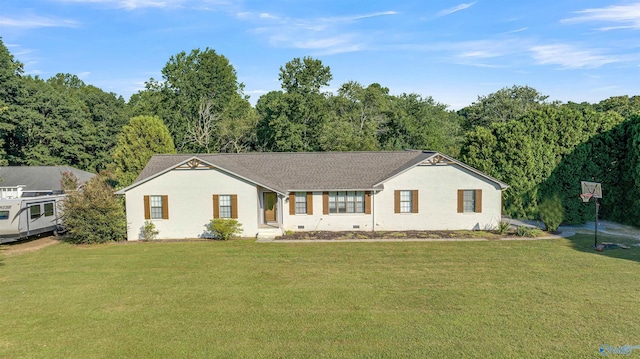 ranch-style home with a front yard, crawl space, and a forest view