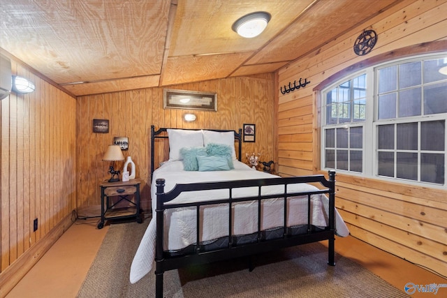 carpeted bedroom with wood ceiling, lofted ceiling, and wooden walls