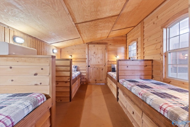 bedroom with lofted ceiling, wood walls, and wood ceiling