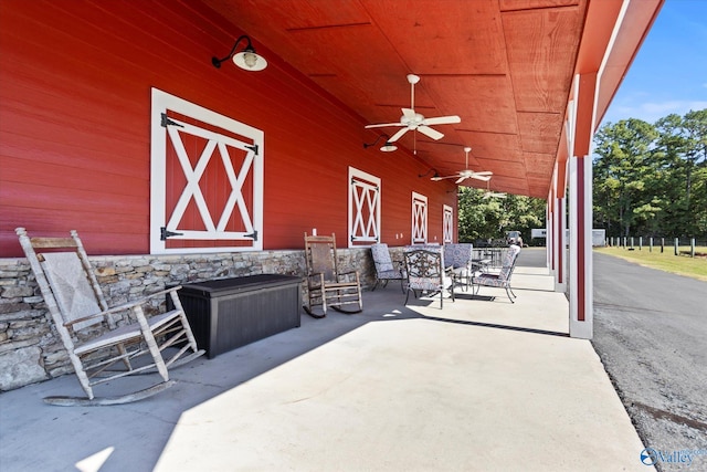 view of patio featuring ceiling fan