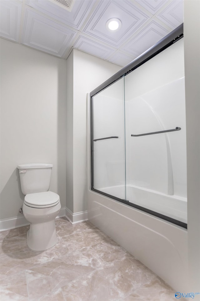 bathroom with shower / bath combination with glass door and toilet