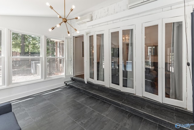 unfurnished sunroom featuring french doors, vaulted ceiling, an inviting chandelier, and a wall mounted air conditioner